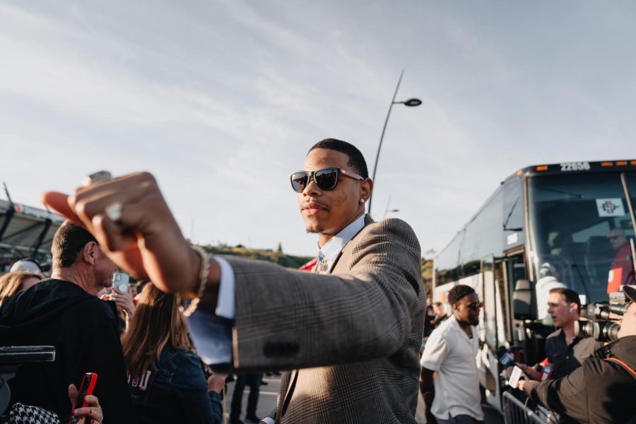 Senior Keshad Johnson reaches out for a fist bump during the SDSU men's basketball celebration on Saturday, April. 8.