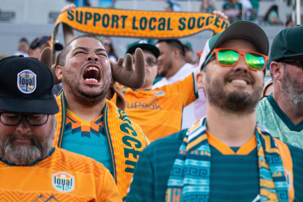 A fan cheers for the San Diego Loyal before the start of a friendly match against Borussia Dortmund at Snapdragon Stadium on July 27.