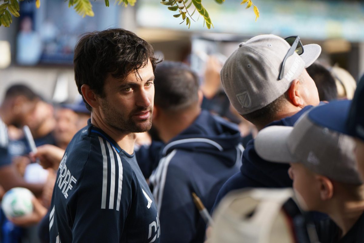 San Diego FC midfielder Luca de la Torre, a San Diego native, interacts with young fans and signs merch at the San Diego FC Kickoff Party on Feb. 16. 