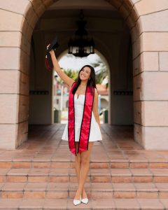 Isabella Dallas celebrates in her cap and SDSU stole at Hepner Hall on April 14, 2025. (Photo by Sidney Giles, @sidneyrayephoto on Instagram)