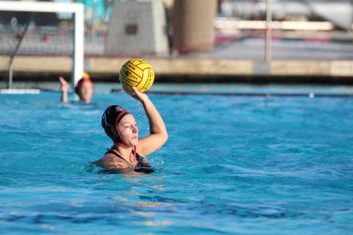 San Diego State attacker Rose Kanemy holds possession of the ball during a water polo match versus Cal State Monterey Bay on Feb. 10. 
